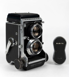 MAMIYA: Mamiyaflex C3 TLR camera [#213035], circa 1962, with Mamiya-Sekor 80mm f2.8 lens [#733413] and metal lens cap.