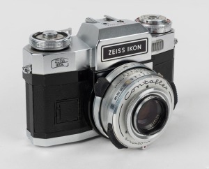 ZEISS IKON: Contaflex Super BC SLR camera [#K 95782], circa 1967, with Tessar 50mm f2.8 lens [#4213719]. Engraving on back indicates that camera was owned by Australian commercial pilot Captain L. M. Diprose.