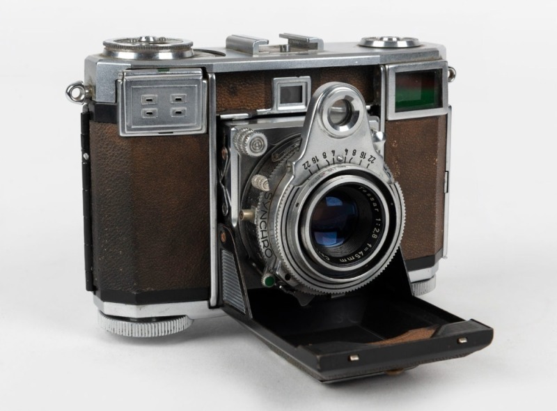 ZEISS IKON: Contessa 533/24 horizontal-folding rangefinder camera [#B 66409], circa 1950, with Tessar 45mm f2.8 lens [#1258990]. 