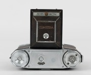 ZEISS IKON: Contessa 533/24 horizontal-folding rangefinder camera [#B 66409], circa 1950, with Tessar 45mm f2.8 lens [#1258990].  - 3