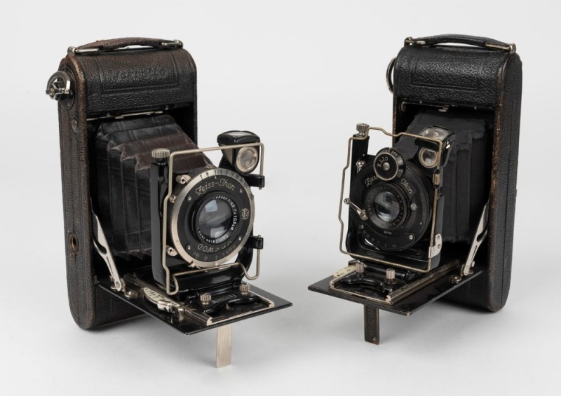 ZEISS IKON: Two circa 1929 Icarette vertical-folding cameras - one with Tessar 105mm f4.5 lens [#1134496] and Compur shutter, and one with Novar 105mm f6.3 lens [#724900] and Klio shutter. (2 cameras)