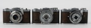 ZEISS IKON: Three circa 1940s Tenax I 570/27 35mm square-format cameras, each with varying lens and shutter details. (3 cameras) - 2