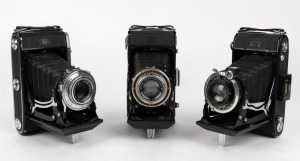 ZEISS IKON: Three Nettar vertical-folding cameras - one 1937 515/2 with Nettar lens and Compur shutter, one 1938 515/2 with Novar lens and Klio shutter, and one 1953 518/2 with Novar lens and Prontor-SVS shutter. (3 cameras)