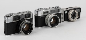 YASHICA: Three circa 1960s rangefinder cameras - one Lynx-1000 [#L2060899], one Electro 35 [#80409336] with lens cap, and one EZ-Matic Electronic [#80812210]. (3 cameras)