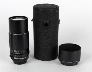 ASAHI KOGAKU: Black SMC Takumar 200mm f4 lens [#5986426], circa 1964, with Takumar 135mm f2.5 - 200mm f4 metal lens hood, front and rear lens caps, and maker's box.