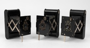 KODAK: Three early 1920s Vest Pocket Autographic folding cameras, each with varying body and lens details. The 'Autographic' feature enabled photographers to write a note onto the special film used in these cameras, which would become visible after development. (3 cameras)