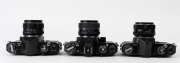 ASAHI KOGAKU: Three circa 1960s black-body SLR cameras - one Pentax ES with SMC Takumar 50mm f4 lens and lens cap, one Pentax Spotmatic with Super-Takumar 55mm f1.8 lens, and one Pentax Spotmatic with Super-Takumar 50mm f1.4 lens. (3 cameras)  - 4