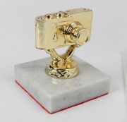 LEITZ: Stylised gold Leica M3 trophy, circa 1991, mounted on 7.5cm x 7.5cm x 2cm Carrara&nbsp;marble stand.