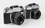 IHAGEE: Two early 1960s SLR cameras - one Exa II [#270880] with Domiplan&nbsp;50mm f2.8 lens [#2823299], and one Exa IIb [#230832], also with Domiplan&nbsp;50mm f2.8 lens [#3553206]. (2 cameras)