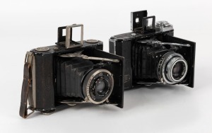 ZEISS IKON: Two circa 1938 vertical-folding cameras - one Ikonta 520 with Tessar 75mm f4.5 lens [#1368539] and Compur shutter, and one Ikonta 521 [#P 85220] with Tessar 75mm f3.5 lens [#82411] and Compur-Rapid shutter. (2 cameras)