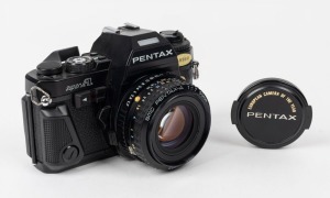 ASAHI KOGAKU: 1983 Pentax Super A SLR camera [#1291602] with SMC Pentax-A 50mm f1.7 lens [#1642992], together with front lens cap bearing 'European Camera of the Year' inscription in gold lettering.