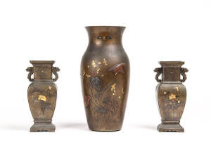 Three Japanese mixed metal vases, decorated with birds and floral motifs in gold and shakudo on bronze, Meiji Period, 30.2cm and pair 20.2cm high