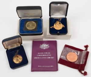 1875 - 1975 La Trobe Centenary silver medal by Stokes in case of issue; a 1980 Melbourne International Exhibition medal  by Stokes; a 1977 Silver Jubilee Australian uncirculated coin set; an 18ct gold lovebird pendent and a silver Motherhood pendent. 