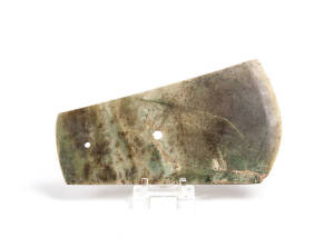 A large Chinese stone axe head, two holes drilled through, old cracks and surface wear, 20th century, 34cm long