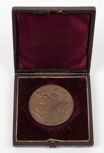 1885 INTERNATIONAL INVENTIONS EXHIBITION prize medal in bronze, "VICTORIA REGINA" and veiled head of Queen Victoria to obverse; reverse with a seated male holding an olive branch and compasses and a female holding a lyre above the inscription tablet. Superb condition in the original gilt embossed leather bound presentation box.