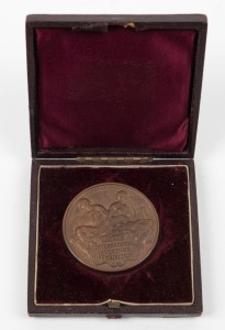 1885 INTERNATIONAL INVENTIONS EXHIBITION prize medal in bronze, "VICTORIA REGINA" and veiled head of Queen Victoria to obverse; reverse with a seated male holding an olive branch and compasses and a female holding a lyre above the inscription tablet. Supe