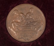 1885 INTERNATIONAL INVENTIONS EXHIBITION prize medal in bronze, "VICTORIA REGINA" and veiled head of Queen Victoria to obverse; reverse with a seated male holding an olive branch and compasses and a female holding a lyre above the inscription tablet. Supe - 3