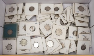 An accumulation of Threepences, Sixpences, Shillings and Florins in a shoebox; the majority are presented in dated cards. (qty).