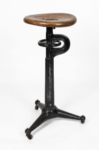 An antique industrial cast iron stool with elm seat, early 20th century, 81cm high. 