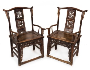 A pair of antique elm Chinese ceremonial armchairs with carved bat decoration, 19th century, 100cm high, 58cm across the arms