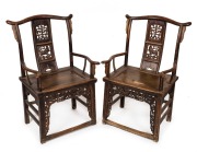 A pair of antique elm Chinese ceremonial armchairs with carved bat decoration, 19th century, 100cm high, 58cm across the arms