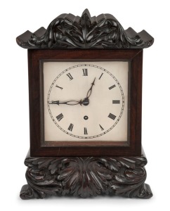 An antique English William IV four glass library clock in rosewood and floral carved decorated case, time only fusee movement with one piece silvered dial and Roman numerals, circa 1845, 30cm high