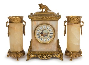 A fine quality antique French three piece clock set in the Chinese style, onyx case with ormolu mounts and Foo dog finial, time only lever platform escapement movement, fine enamel decorated dial with retailers name "Edward & Sons, Paris, London, Glasgow"