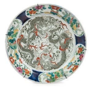 An antique Chinese porcelain charger with olive green dragon decoration to the interior, Qing Dynasty, ​​​​​​​38cm diameter