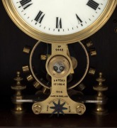 EUREKA CLOCK Co. LTD., LONDON antique lancet top mahogany cased electric timepiece with two ball bearing movements and electric balance wheel, white enamel dial signed by the manufacturers with Roman numerals, made in England, circa 1910, 39cm high - 2