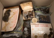 An accumulation of World and Australian coins in a medium carton; some on pages, most in plastic bags. Noted USA, Asian, European, etc., and a few odd medallions, badges, etc. Worth a look.