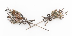A pair of antique silver hat or lapel pins, both engraved "1877, 2/VIII, 1902", 10cm and 11.5cm long