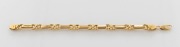 An 18ct yellow gold bracelet with gate-links, stamped "18ct", ​​​​​​​20cm long, 30 grams