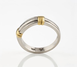 A platinum ring adorned with 18ct yellow gold bands, stamped "750, PLAT." with additional maker's marks (illegible), ​​​​​​​11.5grams total