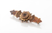 An antique 9ct yellow gold brooch, set with a blue sapphire surrounded by seed pearls, circa 1870s, stamped "B&W, 9ct", ​​​​​​​4.2cm wide, 3 grams