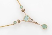 An antique 9ct gold negligee necklace, adorned with four cut aquamarines and seed pearls, early 20th century, the pendant 6cm high, the chain 38cm long, 4.2 grams