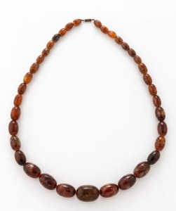 A graduated brown amber bead necklace, 20th century, 70cm long