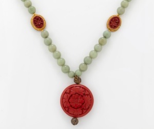 A Chinese jade bead necklace with cinnabar lacquered pendant and spacers set in filigree gilt silver, 20th century, ​​​​​​​56cm long