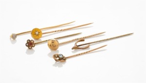 STICK PINS, group of six antique gold examples, including seed pearls, ruby, diamond and aquamarine, 19th/20th century, ​​​​​​​7.2 grams total