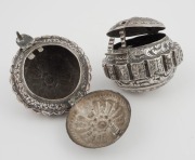 Two antique Malaysian silver tobacco boxes (Chelpa) of broadly spherical form with a shaped apron with scalloped edge. The domed sides with chased and repoussé decoration of trailing foliage centred with a leafy fluted rosette, all edged with a quatrefoil - 2