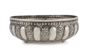 An antique Indian silver bowl adorned with 17 Kutch-style repousse floral panels, Lucknow, Uttar Pradesh (North India), circa 1900, 8cm high, 23cm diameter, 374 grams
