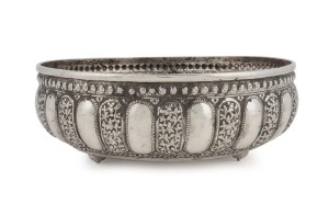 An antique Indian silver bowl adorned with 17 Kutch-style repousse floral panels, Lucknow, Uttar Pradesh (North India), circa 1900, 8cm high, 23cm diameter, 374 grams
