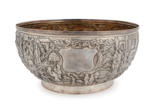 A vintage English silver bowl finely adorned with repousse decoration in the Chinese style, interior finished in gilt, 20th century, 10cm high, 20.5cm diameter, 584 grams