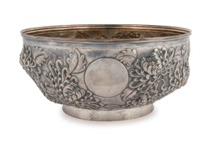 A vintage English silver bowl finely adorned with Chinese floral repousse decoration, interior finished in gilt, 20th century, stamped with retailer's details "LUEN WO, SHANGHAI, CANTON", 10cm high, 21cm diameter, 472 grams