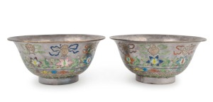 A fine pair of antique Chinese silver bowls adorned with floral enamel decoration, 19th/20th century, both comprehensively stamped with four seal marks, 8cm high, 16.5cm wide, 376 grams total