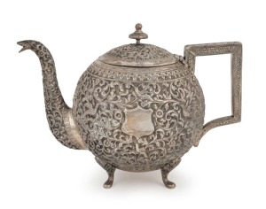 An antique Indian Kutch silver teapot, 19th/20th century, 17cm high, 23cm wide, 758 grams