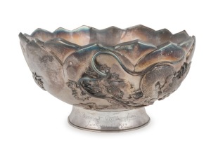 An antique Japanese silver lotus bowl with dragon decoration, double walled construction, Meiji period early 20th century, seal mark to base, 10cm high, 18cm wide, 450 grams