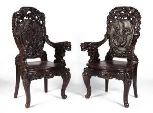 A pair of Japanese hardwood dragon chairs, carved and pierced design, early 20th century, 115cm high