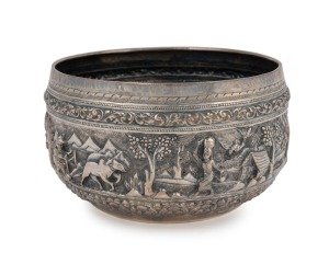 A Burmese silver bowl adorned with repousse decoration, 20th century, 9.5cm high, 16cm wide, 350 grams
