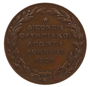 1896 Athens Olympics, bronze participation medal; 50mm; designed by N. Lytras; seated Nike holding laurel wreath over phoenix emerging from flames, Acropolis in background. Lovely condition.