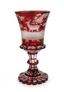 An antique Bohemian ruby overlay chalice with handsome wheel engraved woodland decoration featuring two deer in landscape, circa 1850, 21.5cm high